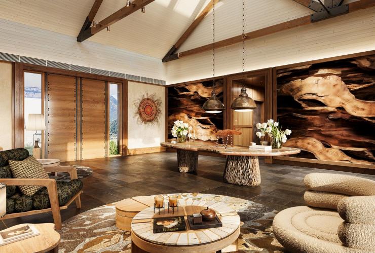 新南威尔士州，蓝山，阿联酋航空沃根谷丽思卡尔顿隐世精品度假酒店，铺设石板地面的前台区，以木石元素装饰，配有舒适座位 © Emirates Wolgan Valley, a Ritz-Carlton Lodge 版权所有
